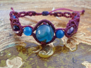 Macramé bracelet with blue and violet beads